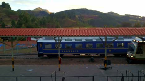 Pedestal-Drone-Shot-at-a-Train-Station-in-Poroy-with-Carriages-Waiting-to-Depart-to-Machu-Picchu,-Peru