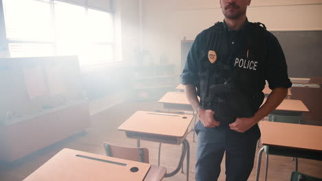 Police-officer-walking-through-class-desks