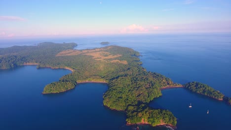 Drone-video-overlooking-the-beautiful-Parida-Islands-in-Panama-with-colorful-clouds-looming-over-the-horizon-off-in-the-distance-at-sunrise