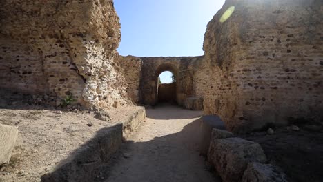 Sunlit-ancient-Roman-ruins-of-Carthage-in-Tunisia,-clear-blue-sky,-historical-ambiance
