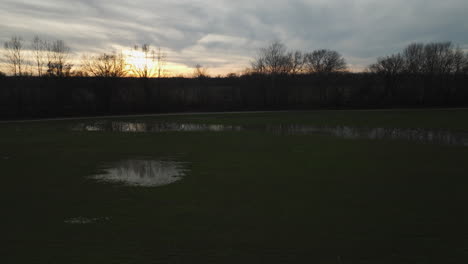Twilight-over-Loosahatchie-Park,-TN,-with-wetland-reflections-and-trees