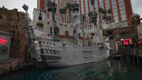 Treasure-Island-casino-hotel-exterior-with-pirate-ship-replica,-Las-Vegas-resort