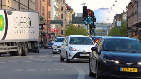 Static-shot-of-traffic-on-Stockholm-street-with-Globe-Arena-in-background