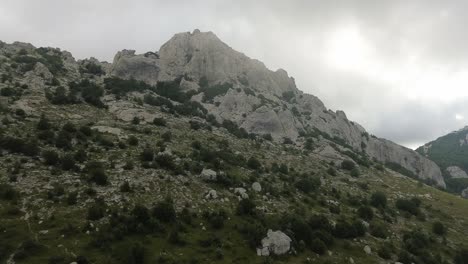 Aerial-flight:-Flying-closer-to-the-mountains-of-Croatia's-Velebit-National-Park-on-a-cloudy-morning