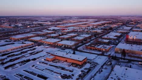 Industrial-area-covered-in-snow-during-sunset