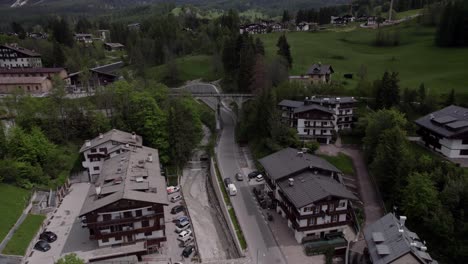 Beautiful-Italian-alpine-Village-Cortina-D'Ampezzo,-aerial-reveal