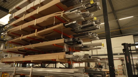 Establishing-shot-inside-PVC-piping-warehouse-stacked-shelves-with-packaged-stock-tubing