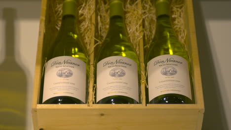 Three-bottles-of-chardonnay-of-Don-Nicanor-from-Argentina-in-wooden-box