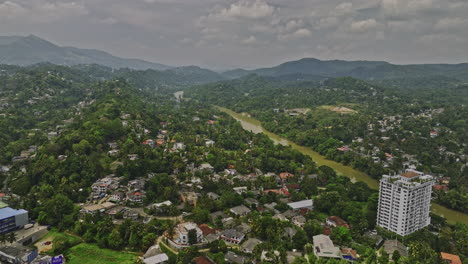 Kandy-Sri-Lanka-Aerial-v4-panoramic-views-drone-flyover-A9-Katugastota-Rd-capturing-riverside-Wattarantenna-suburb,-Mahaweli-river-and-rolling-hills-landscape---Shot-with-Mavic-3-Cine---April-2023