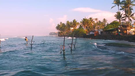 Aerial-Over-Waves-Off-Off-Ahangama-In-Sri-Lanka-To-Reveal-Stilt-Fisherman