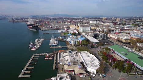 Oakland-CA-USA,-Aerial-View-of-Inner-Harbor,-Jack-London-Square-Buildings-and-Marina,-Drone-Shot