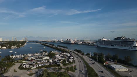 Miami-Florida-USA,-Aerial-View,-Cruise-Ship-Port-Terminal-and-MacArthur-Causeway-Traffic,-Drone-Shot
