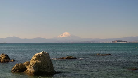 Beautiful-view-out-on-Mount-Fuji-and-Enoshima-island-on-clear-winter-day-at-ocean