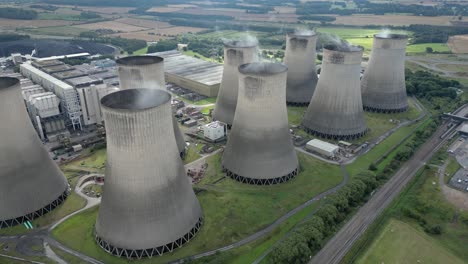 Establishing-aerial-view-Ratcliffe-on-Soar-nuclear-power-station-steaming-cooling-towers-emissions
