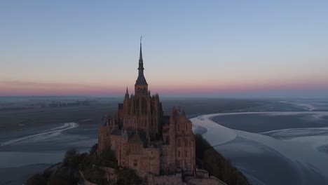 Mont-Saint-Michel-during-golden-hour-at-sunset,-Normandy-in-France