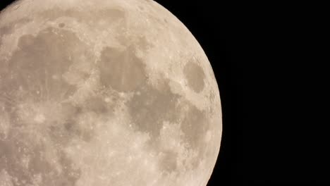 -Bright-and-detailed-close-up-shot-of-the-full-moon,-shining-on-a-pitch-black-night-sky