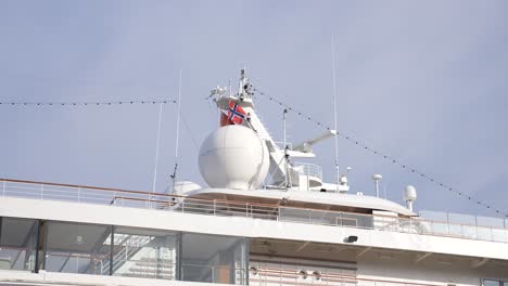 Norwegian-National-Flag-Waving-on-Cruise-Ship-on-Sunny-Day,-Slow-Motion