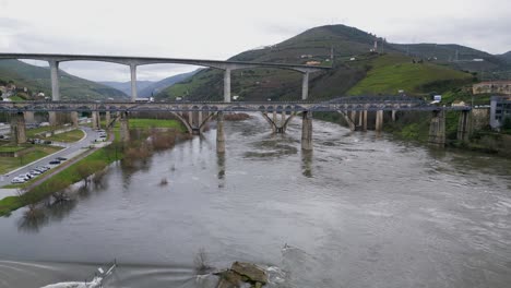 Triple-Bridges-Overlapping-in-Pêso-da-Régua,-Portugal---aerial