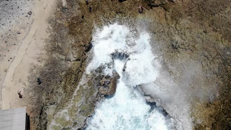 Aerial-shot-of-Shete-Boka-National-Park,-Curacao-with-waves-crashing-into-coves