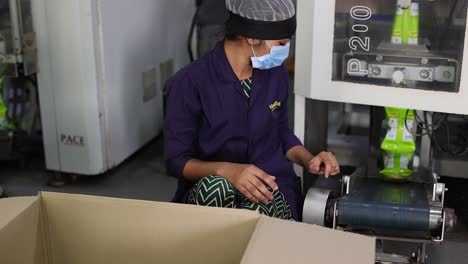 pov-shot-slow-motion-seen-in-which-men-are-arranging-chips-packets-into-boxes