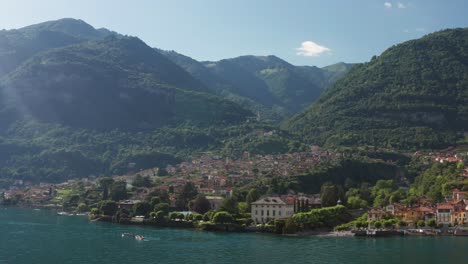 Lush-greenery-surrounds-Ossuccio,-Italy,-with-its-quaint-buildings-nestled-by-the-lake