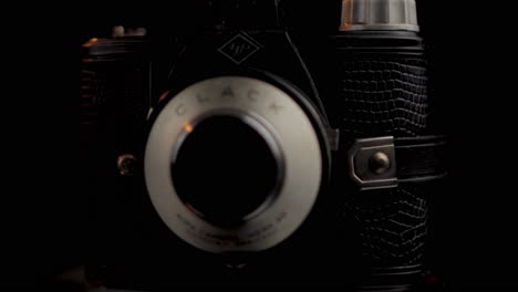 Vintage-Analog-Agfa-Clack-Photo-Film-Camera,-Close-Up-Spinning,-Black-Background