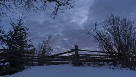 Cloudy-Sky-At-Sunrise-Over-Snowy-Landscape-In-Winter