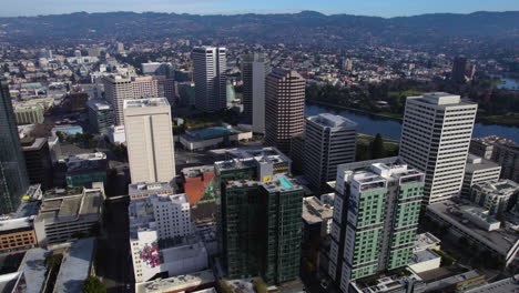 Oakland-CA-USA,-Aerial-View-of-Downtown,-Residential-Towers,-Streets-and-Parks-by-Lake-Merritt-on-Sunny-Day
