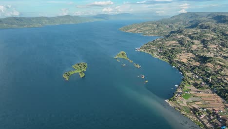 Samosir-island-in-sumatra-with-clear-blue-waters-and-lush-landscapes,-aerial-view