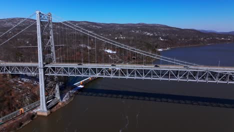 An-aerial-view-of-the-Bear-Mountain-Bridge-on-a-sunny-day-with-clear-blue-skies