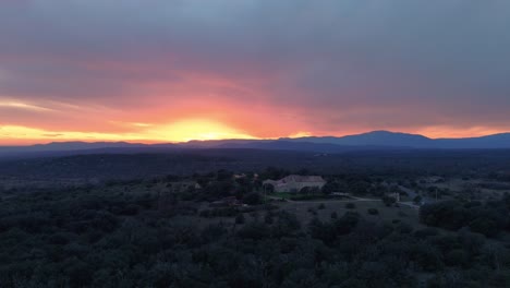 Aerial-above-southern-France-rural-landscape-with-luxurious-mansion-during-sunset