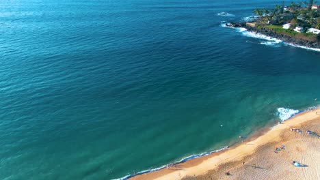 Drone-flyover-Waimea-Bay-Beach-revealing-Pacific-Ocean-Seascape,-Ohau