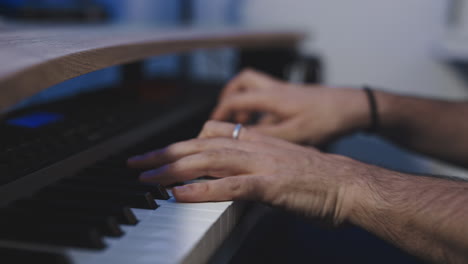 caucasian-hand-male-close-up-while-performing-a-studio-piano-session-recording-a-new-album