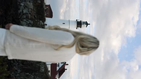 Blonde-Woman-Looking-Towards-Portland-Head-Light-Lighthouse