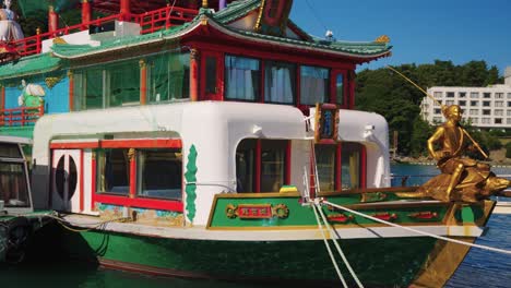Japanese-Pleasure-Dining-Boat,-Yakatabune-with-Urashima-Taro-Statue-in-Toba