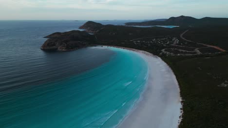 aerial-view-of-Lucky-Bay-in-Cape-Legrand-National-Park-at-sunrise-with-a-sof-light-and-turquoise-water,-western-australia