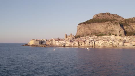 Aerial-view-of-Cefalu-medieval-city-during-summer-at-sunset,-Sicily,-Italy