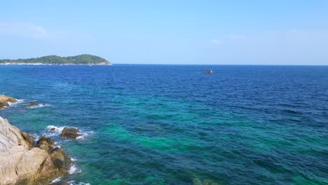 Crystal-clear-water-on-rocky-sandy-thai-island-beach