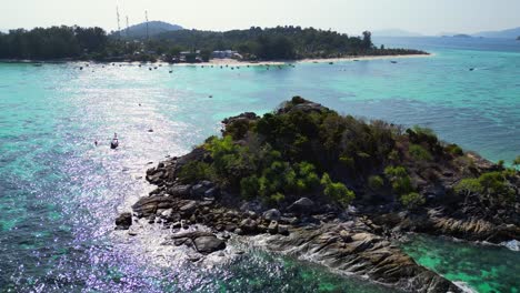 beach-rocky-cliff-island-turquoise-blue-sea