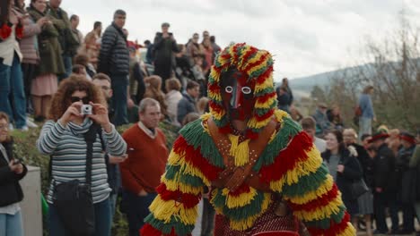 Joyful-Careto-Jumps-Amongst-Crowd,-Podence-entrudo,-Portugal