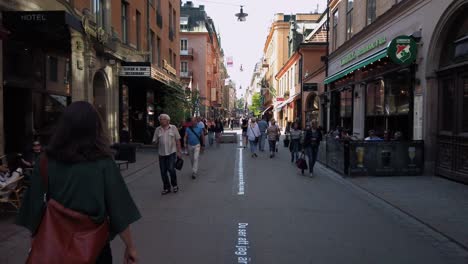 Slo-mo-footage-of-people-walking-on-Drottninggatan-in-central-Stockholm,-Sweden