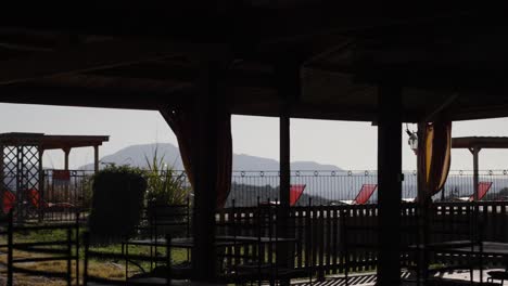 Lounging-balcony-area-with-sun-chairs-and-a-nicely-decorated-yard,-near-the-Pic-Saint-Loup,-one-of-the-most-famous-vineyards-of-the-Languedoc,-France