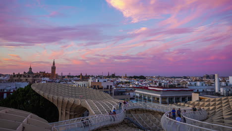 Colorful-timelapse-during-sunset-from-the-Metropol-Parasol-in-Sevilla-while-tourism-enjoys-the-view