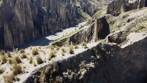 Aerial-flyover-narrow-ridge-to-reveal-Valle-de-las-Animas-rock-spires