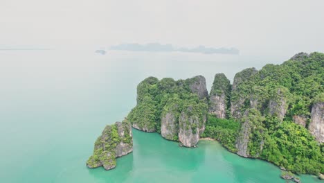 Scenic-Aerial-Views-of-Ko-Roi-with-Limestone-Rocks-and-Turquoise-Waters-Surrounding-the-Island-in-Thailand