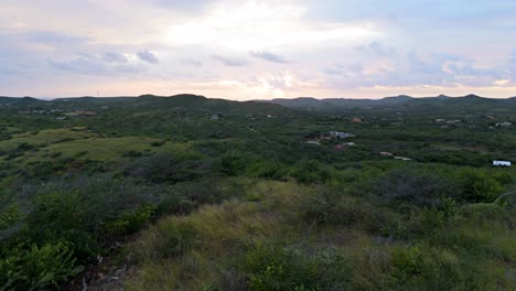 Panoramic-aerial-dolly-above-Curacao-hiking-hills-in-Caribbean-outskirts-on-leeward-side