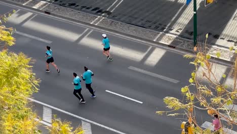 Aerial-View-of-Marathon-Runners-Taking-Over-a-city-street