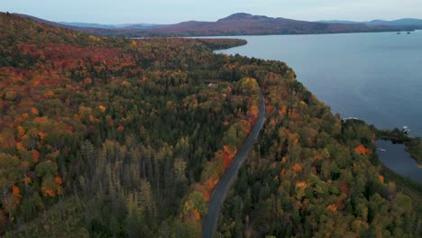 aerial-view-of-lanaudiere-region-in-Quebec-in-autumn-with-colorful-trees-and-a-lake-on-an-overcast-day,-Canada