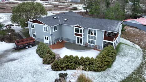 Two-story-house-covered-in-snow-on-Whidbey-Island