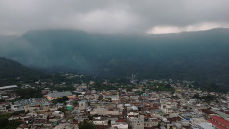 Aerial:-Panoramic-drone-shot-of-San-Juan-La-Laguna-village-in-Guatemala-during-a-cloudy-day